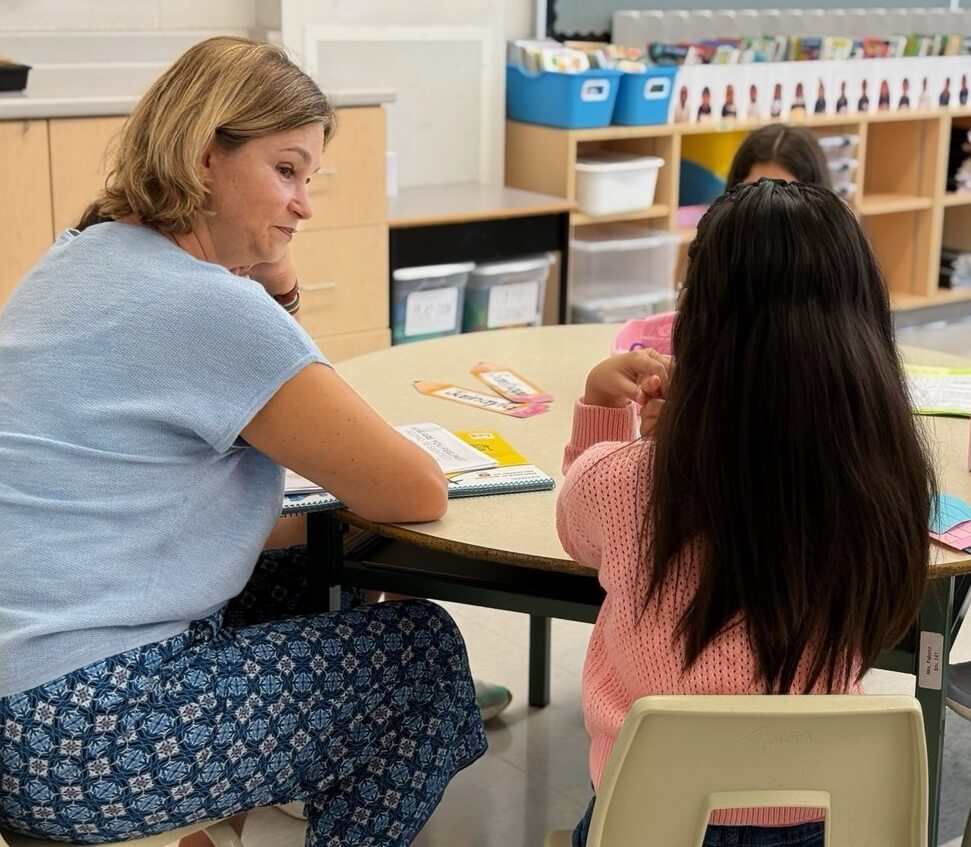 Spanish teacher giving personalized help during class