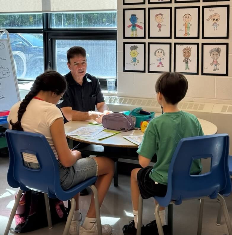 Teacher leading a small-group Spanish lesson for children